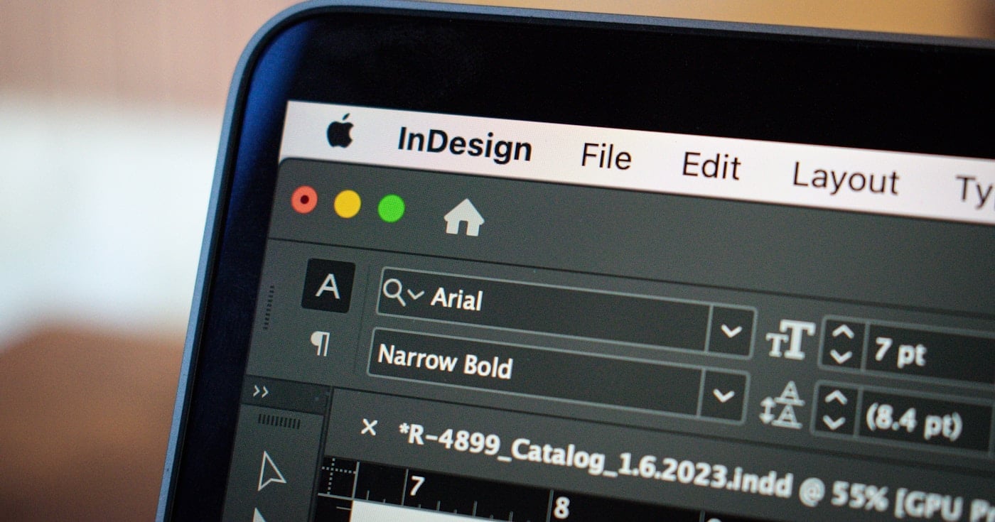 Designer working with AI tools in a modern creative setup