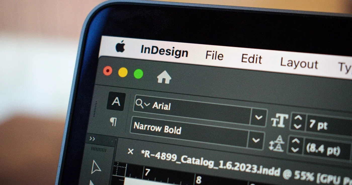 Designer working with AI tools in a modern creative setup